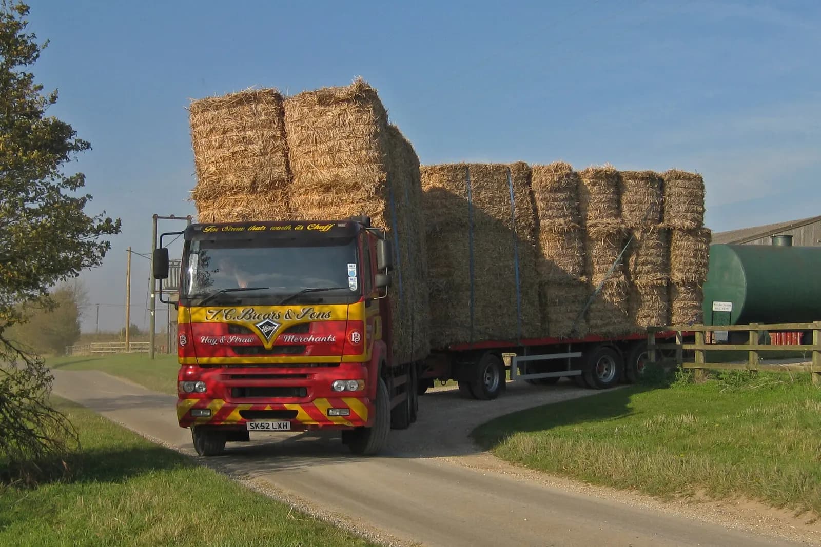 A truck loaded with baled biomass on its way to a plant
